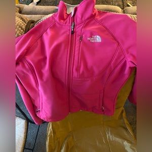 North face pink woman’s small, zip up with fur inside